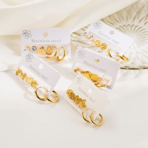 Golden stainless steel earring set featuring butterfly, crown, and star motifs
