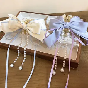 Elegant multi-layer ribbon hair claw clips with pearls in cream and light purple colors