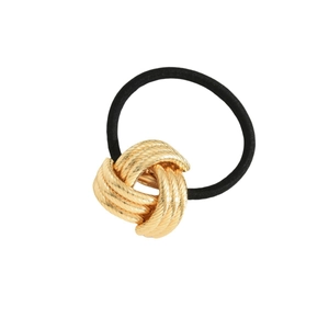 Minimalist elastic hair tie with a polished gold metal knot design on a white background