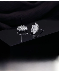 Close-up of S925 sterling silver snowflake earrings with sparkling marquise zircon stones