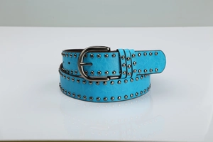 Detail of sky blue PU leather belt with double rows of metal studs and buckle