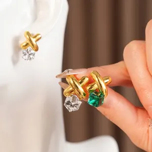 Vintage gold crisscross stud earrings with emerald green and clear geometric cubes