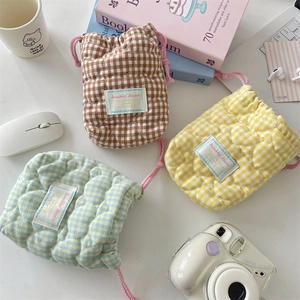 Padded gingham quilted drawstring camera pouches in brown yellow and blue for outdoors
