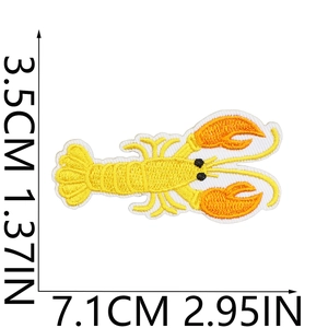 Detailed view of yellow lobster embroidered patch with precise 7.1cm x 3.5cm dimensions
