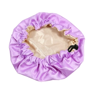 Detail of adjustable kids satin bonnet showing light purple and champagne gold silk texture