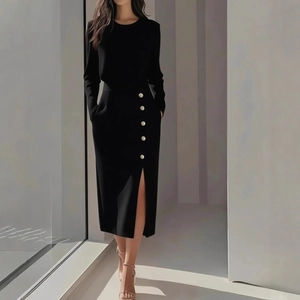 Elegant black long sleeve crew neck dress with gold buttons and side slit detail
