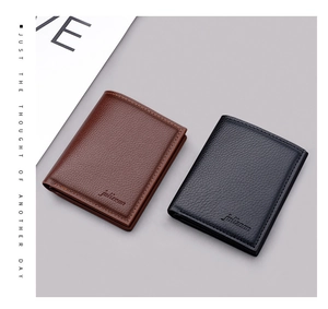 Detailed view of vertical minimalist wallets in black and brown lychee grain leather