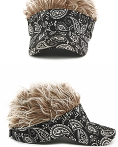 Detail view of ethnic baseball cap with white paisley pattern and brown wavy wig hair