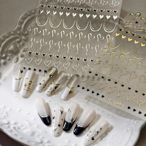 3D metallic gold and silver heart nail art stickers with minimalist curved line patterns