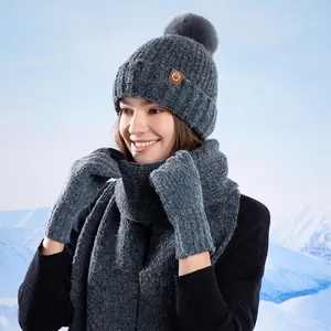 Winter knit hat scarf and gloves set for women featuring grey sequins and faux fur pompom