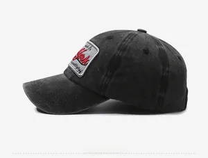 Detail of vintage washed denim baseball cap with York embroidery on a side patch