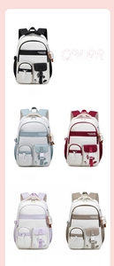 Detailed grid view of high-capacity student backpacks in five colors with plush charms