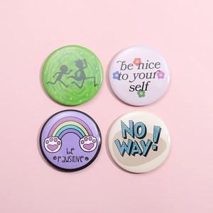 Set of four cute cartoon round badges with anime silhouettes and motivational quotes