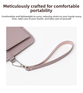 Detail of lavender litchi leather coin purse with silver metal clasp and wrist strap