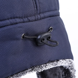 Winter bomber hat in navy blue with thick faux fur lining and adjustable toggle