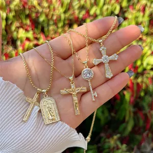 Set of 18K gold plated necklaces featuring cross, key, and medallion pendants with zircons