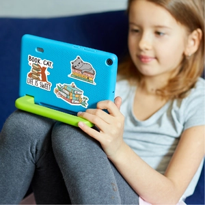 Detail showing waterproof book and cat stickers on a blue tablet case held by a child