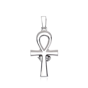 Macro shot of silver Ankh cross pendant with eye of Horus engraving and polished finish