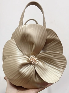 Champagne gold petal-shaped tote bag with 3D flower design and metallic luster finish