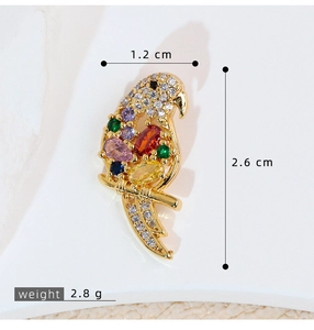 Detailed view of parrot charm dimensions 2.6cm by 1.2cm with weight 2.8g