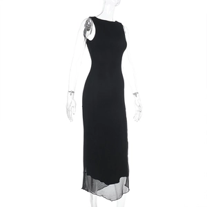 Detail of black sleeveless knit maxi dress featuring a sheer mesh patchwork hemline
