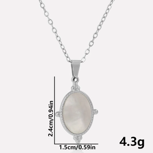 Detail view of 304 stainless steel oval pendant with white shell inlay, size 24x15mm