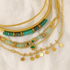 Bohemian gold layered bracelet with natural green beads and evil eye charm pendant