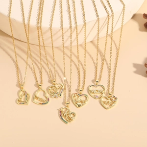 Detail of gold heart pendant necklaces featuring colorful zircons and Mom engraving