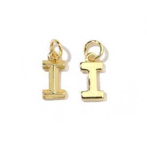 Detail of two gold-plated letter I charms with cubic zirconia for DIY jewelry