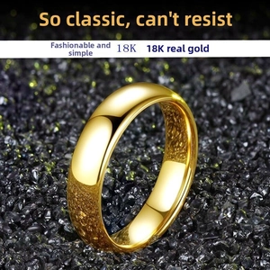Detailed close-up of 18K gold plated minimalist titanium ring with high polished finish