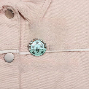 Set of Taylor Swift inspired enamel pins displayed on pink denim jacket accessory