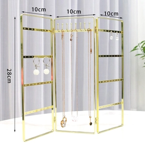 Three-panel gold metal jewelry rack showing 28cm height and 10cm width dimensions