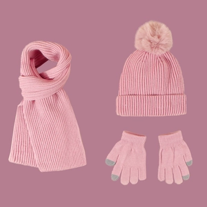 Pink kids knit set with pom-pom beanie, ribbed scarf, and touchscreen gloves
