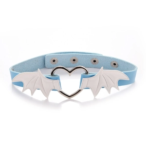 Detailed view of blue leather choker with heart ring and white bat wings on white background