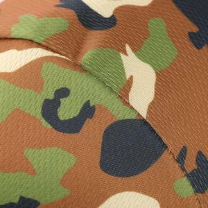 Macro shot of durable woodland camouflage fabric with fine mesh texture and stitching