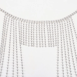 Close-up of sparkling silver rhinestone tassels on fashionable creative headwear