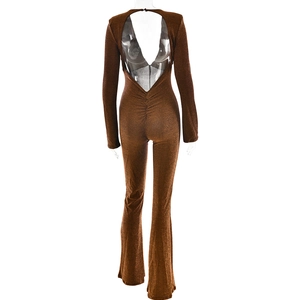 Deep brown backless jumpsuit with long sleeves, shimmer texture, and flared legs