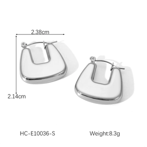 Detail view of silver hollow U-shaped earrings showing dimensions 2.38cm by 2.14cm