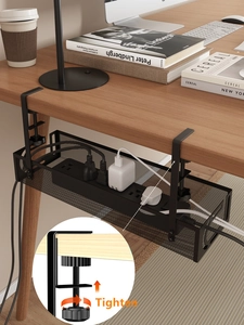 Close-up of black metal wire management tray with C-clamp for under desk cable organization