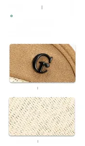 Detail of woven straw texture and gold metallic G-logo on a wide brim sun hat