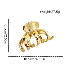 Golden metal hair claw clip for bun hairstyles with size and weight dimensions shown