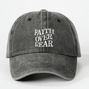 Washed dark grey cotton baseball cap featuring Faith Over Fear embroidery on front