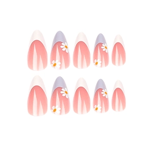 French almond press-on nails with peach pink base, white tips, and small daisy patterns