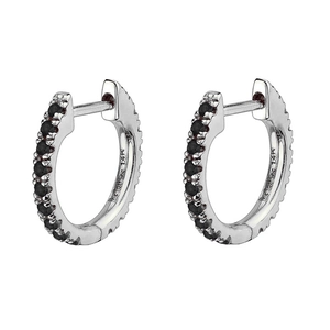 Close-up of 14K white gold huggie hoop earrings with micro-pave black gemstones