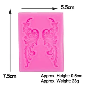 Pink silicone fondant mold with symmetrical scroll patterns for lace cake decoration