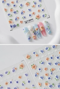 Macro detail of TS-2234 embossed nail stickers with 3D floral textures and orange accents