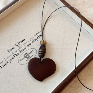 Minimalist dark brown wooden heart pendant necklace with natural beads on wax cord