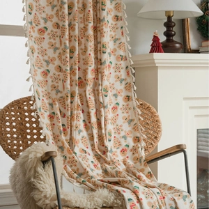 Christmas gingerbread man curtain with cream base, green trees, and elegant tassel trim