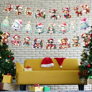 Christmas party banners with reindeer, teddy bear, and tree patterns on white brick wall