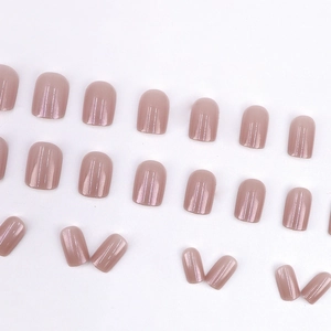 Set of 24 pearl shimmer mauve press-on nails with glossy almond finish in minimalist style